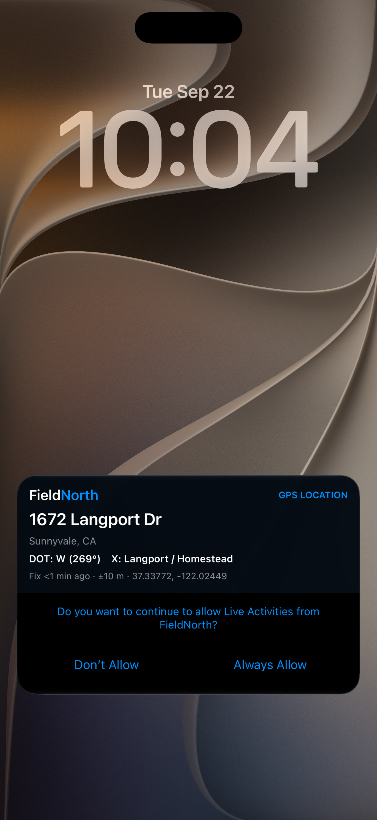 FieldNorth Live Activity on an iPhone Lock Screen showing 1672 Langport Drive in Sunnyvale, direction of travel, cross streets, and the iOS Live Activities permission prompt